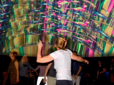 Disco with dancing people with live VJing visuals in our mobile 360degree event location "infinityDome".